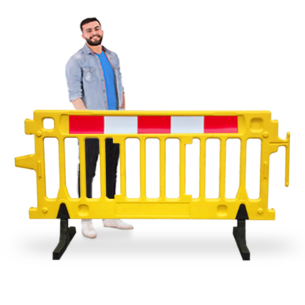 Yellow Plastic Barricade with reflective strip and guy standing behind it